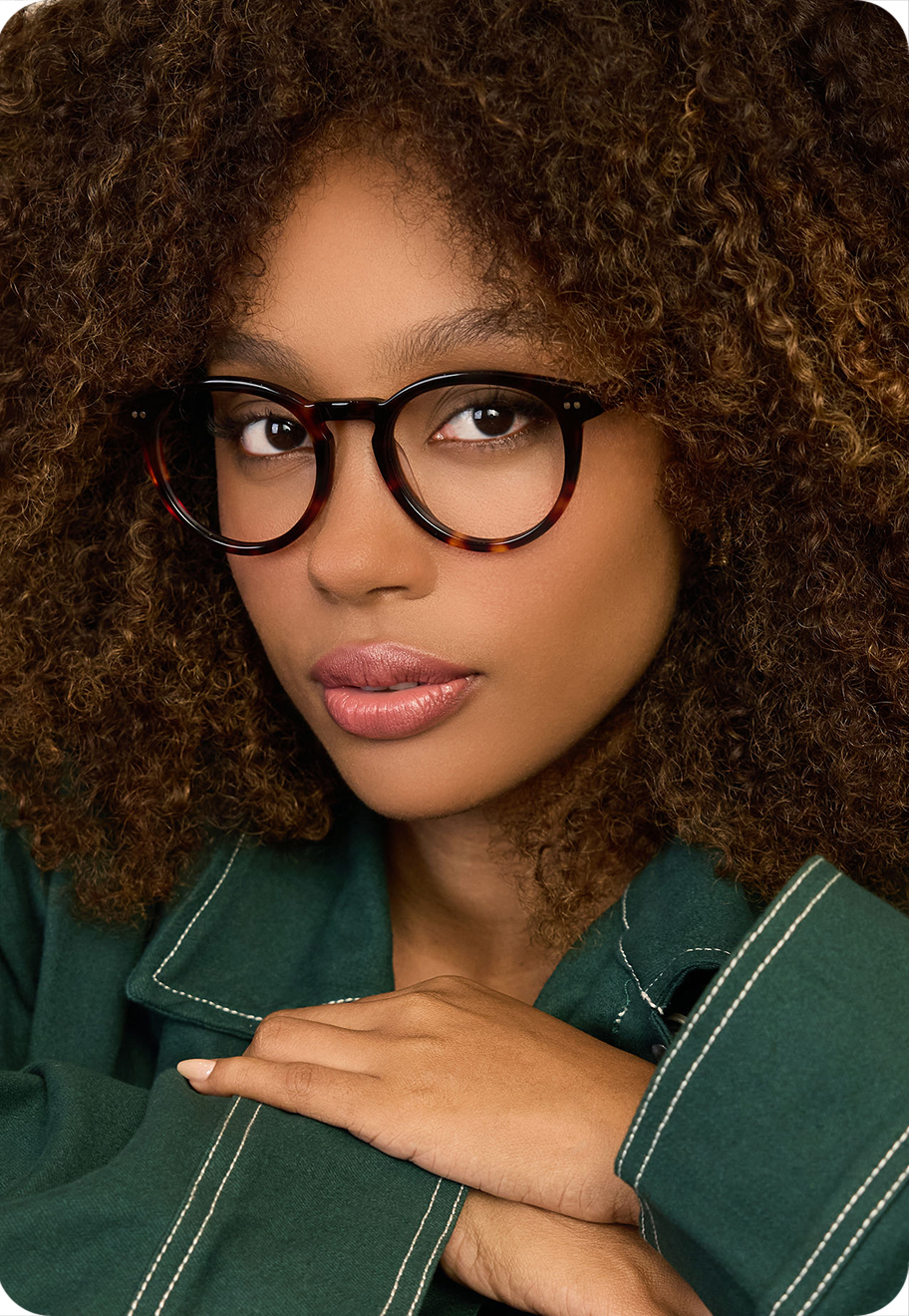 A photo of a model wearing OW Bowery optical glasses in Gold.