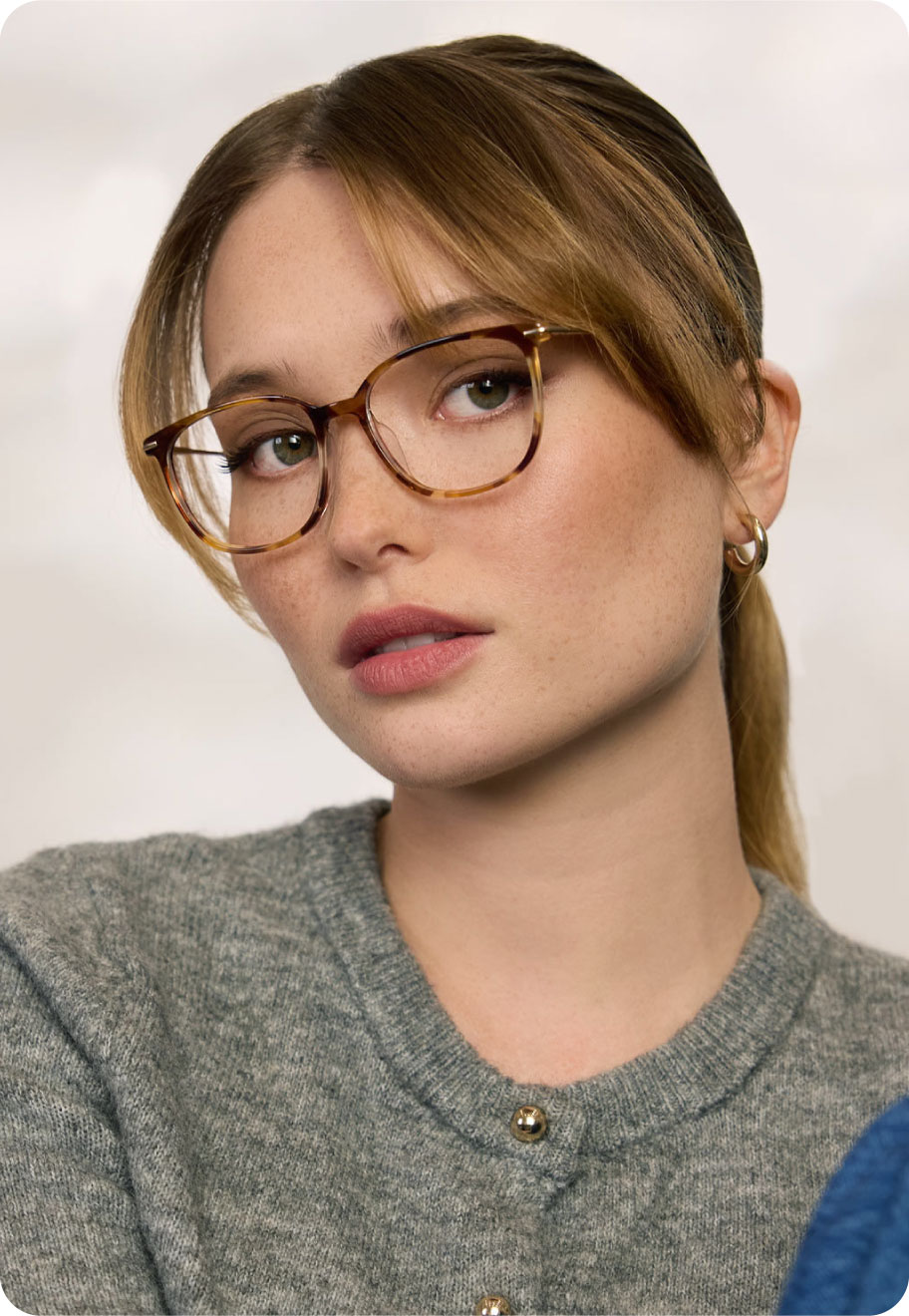 A model wearing Oscar Wylee Mumford lightweight glasses.