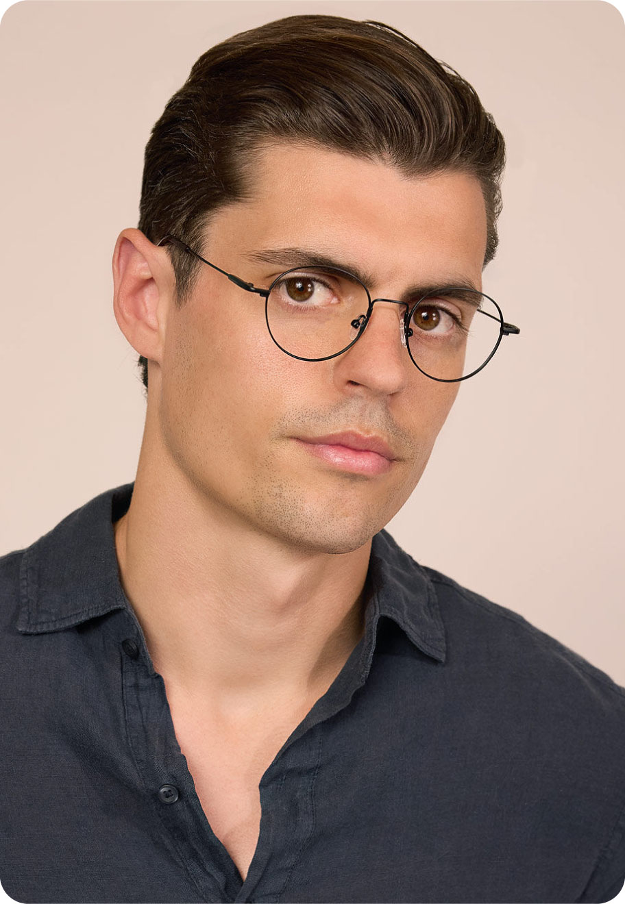 A model wearing Oscar Wylee Mackenzie lightweight glasses.
