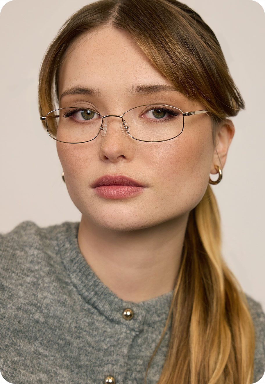 A model wearing Aerin in gold.