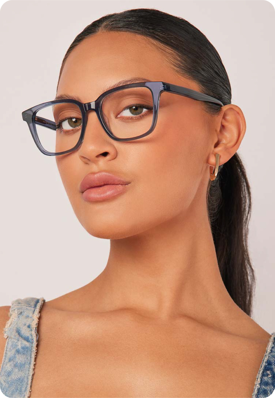 A model wearing Jinky optical glasses in Surf Blue.