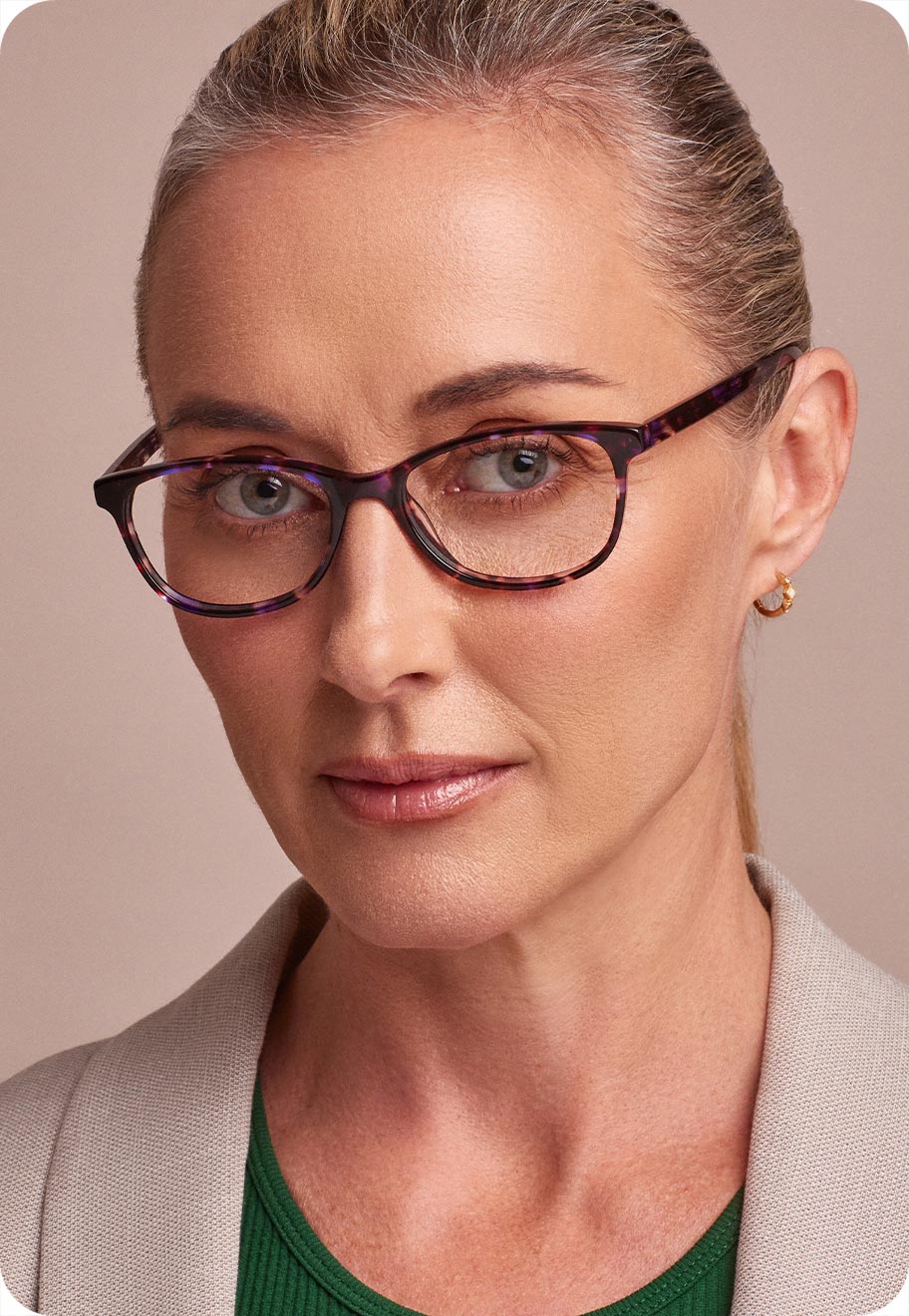 A photo of a senior woman wearing optical glasses.