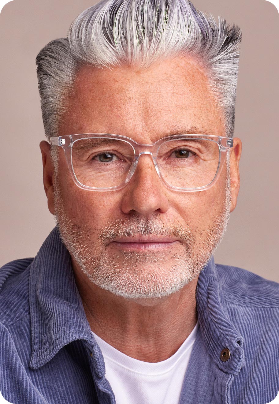 A photo of a senior man wearing optical glasses.