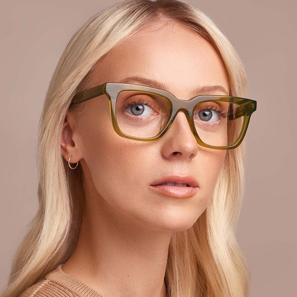 Model wearing Serge optical frame in Crystal Pine.