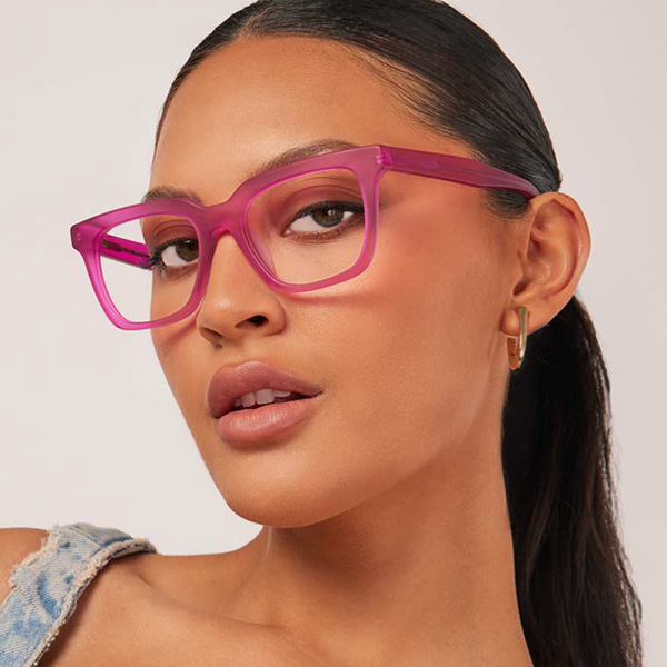Model wearing Serge optical frame in Matte Electric Pink.
