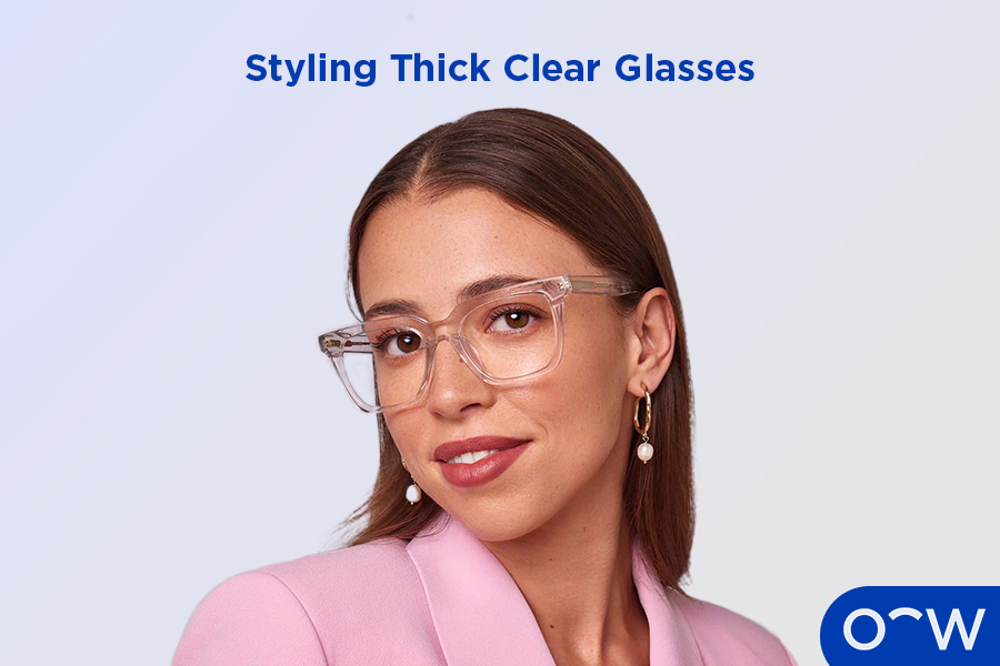 A woman wearing thick, clear glasses