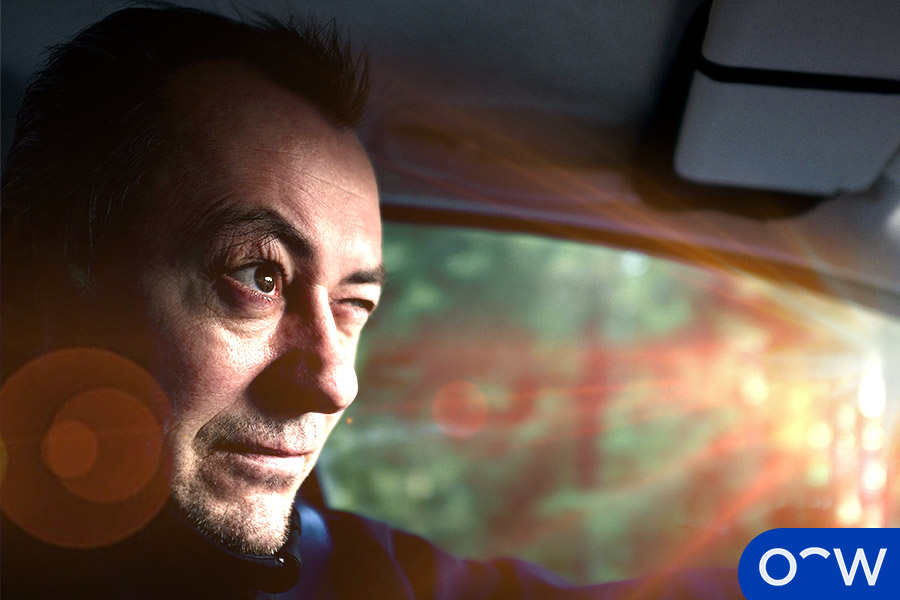 A person squints in the light from the sun, as their eyes are sensitive.