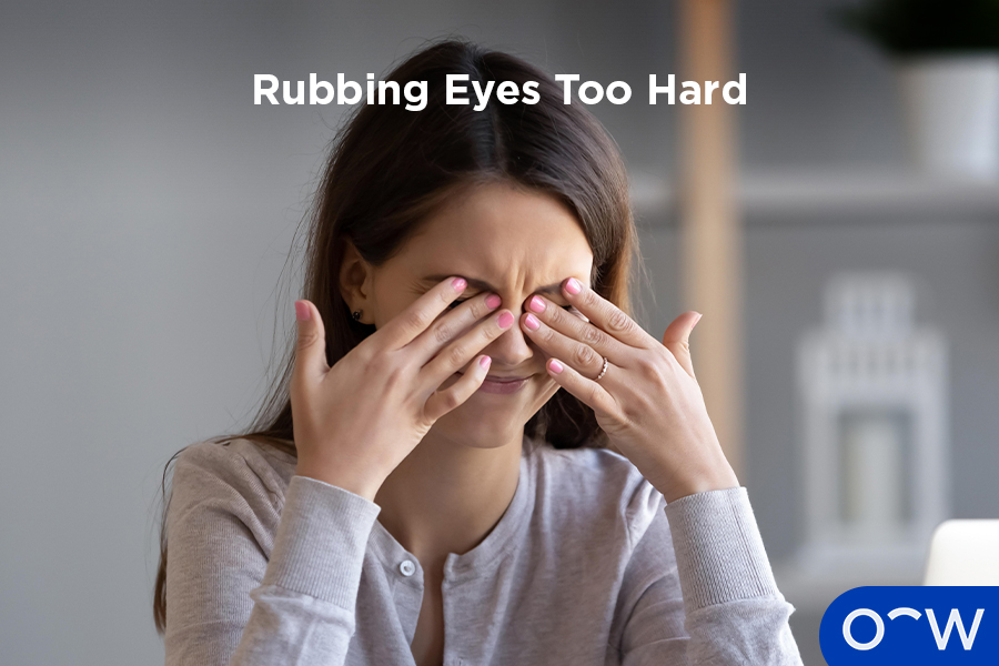  A woman rubbing her eyes too hard
