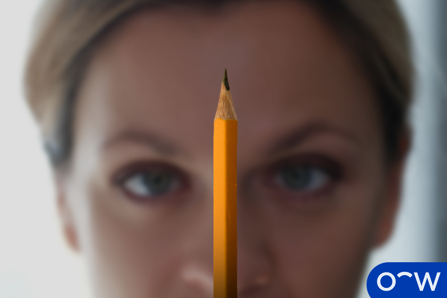 Pencil Push-Ups. A person looking at a pencil in front of them.