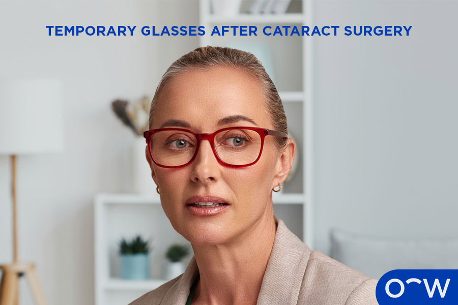 A photo of an elderly woman wearing rectangular glasses with a pencil in hand.