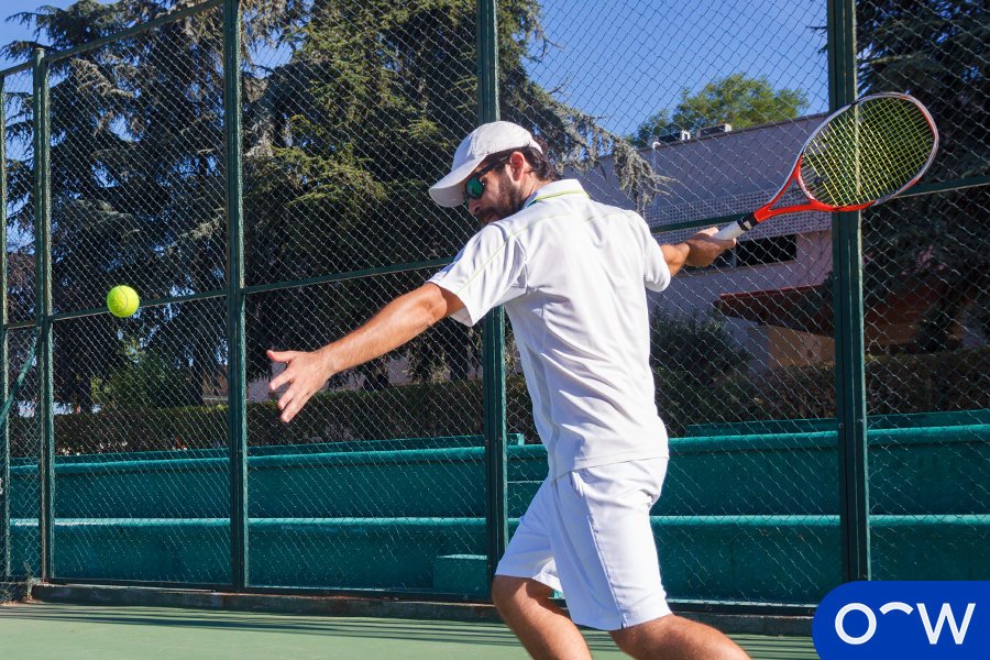 Image of a man playing tennis