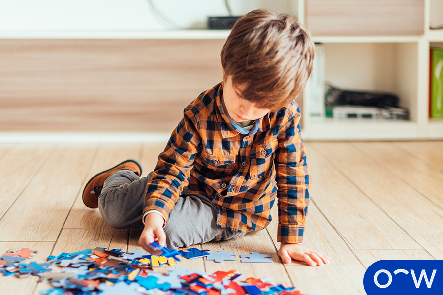 Image of a toddler playing with a puzzle