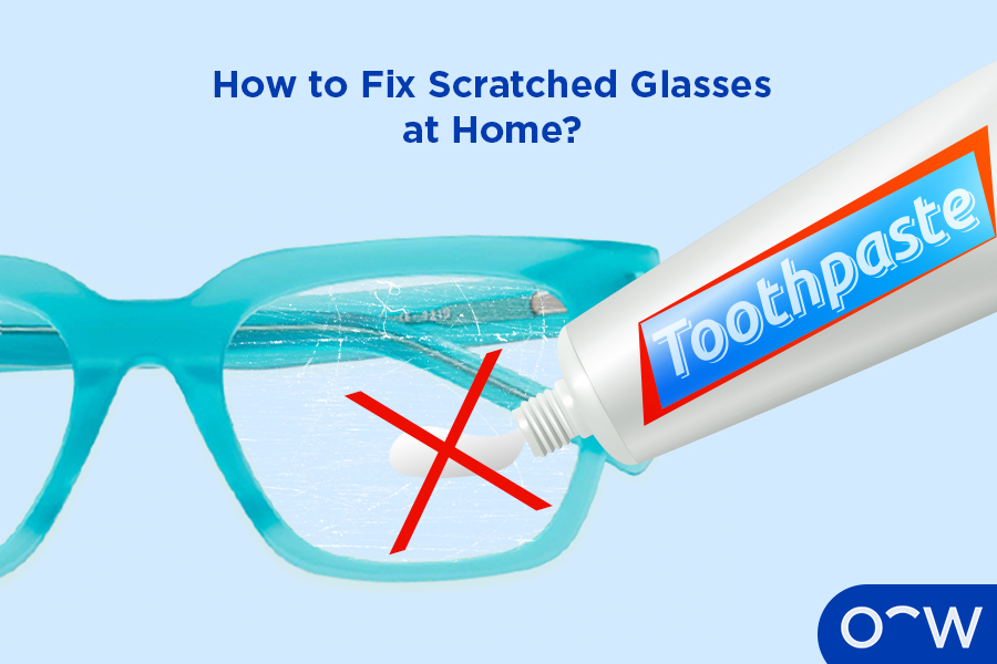 An image of glasses with a scratch, with someone putting toothpaste on the scratch. There is a big x across the toothpaste, as this is not a good method for removing scratches on.