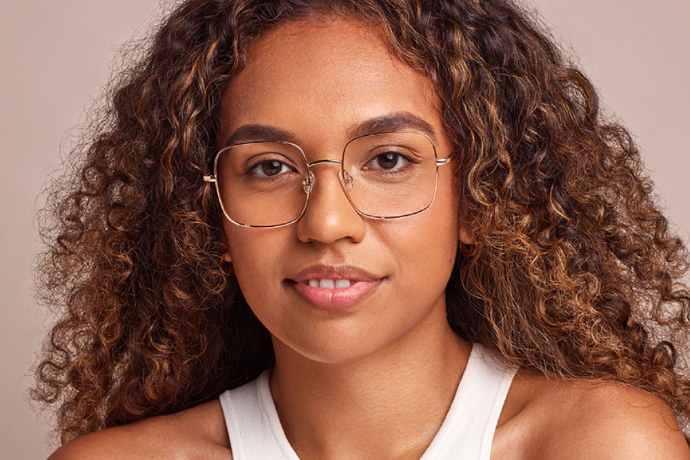 Ford eyeglasses frame worn by model.